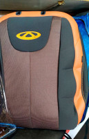 Чехлы на Cherry Tiggo 2 из экокожи и гобелена с оранжевыми вставками